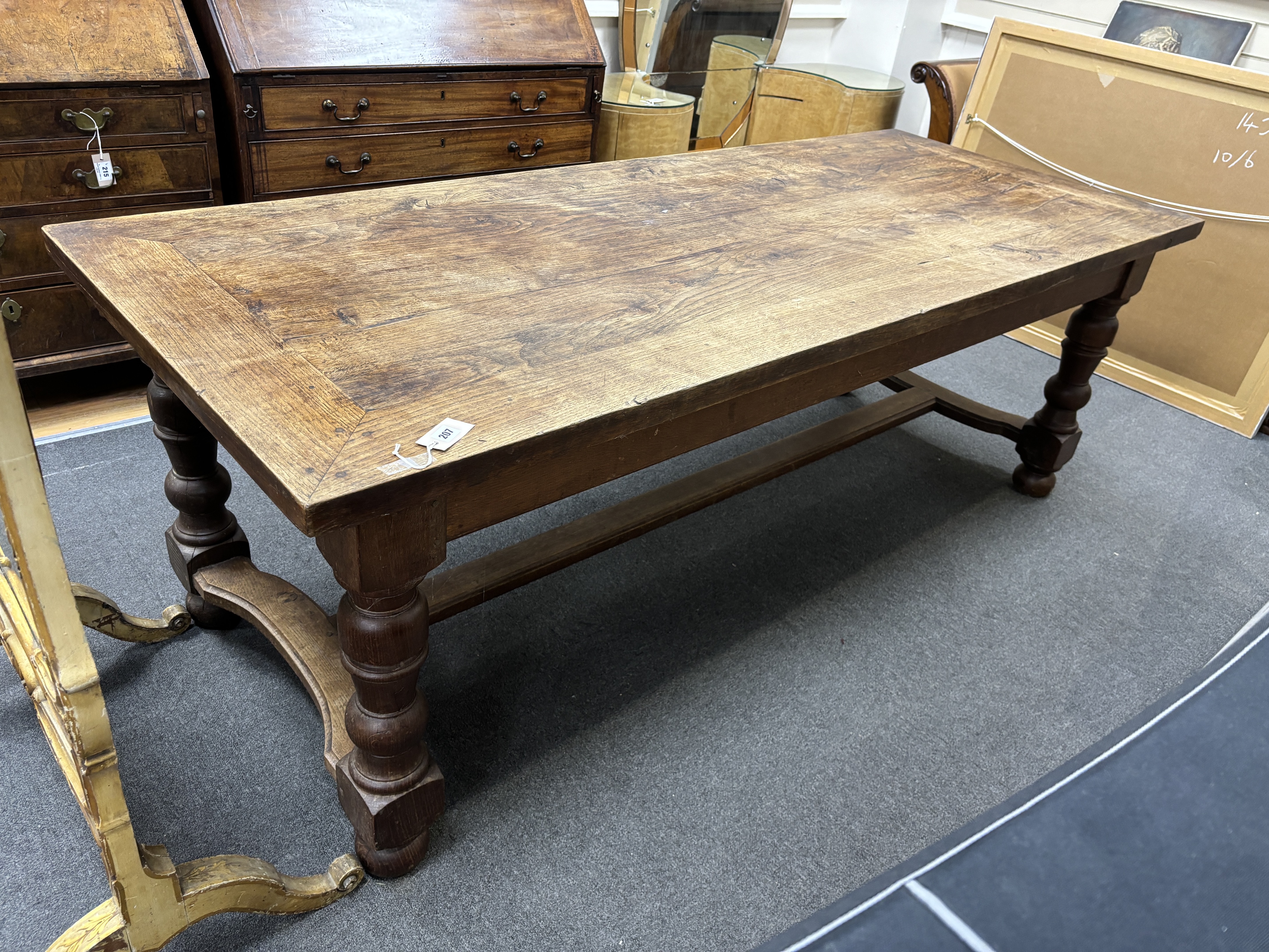 A rectangular oak refectory dining table, length 217cm, width 87cm, height 74cm